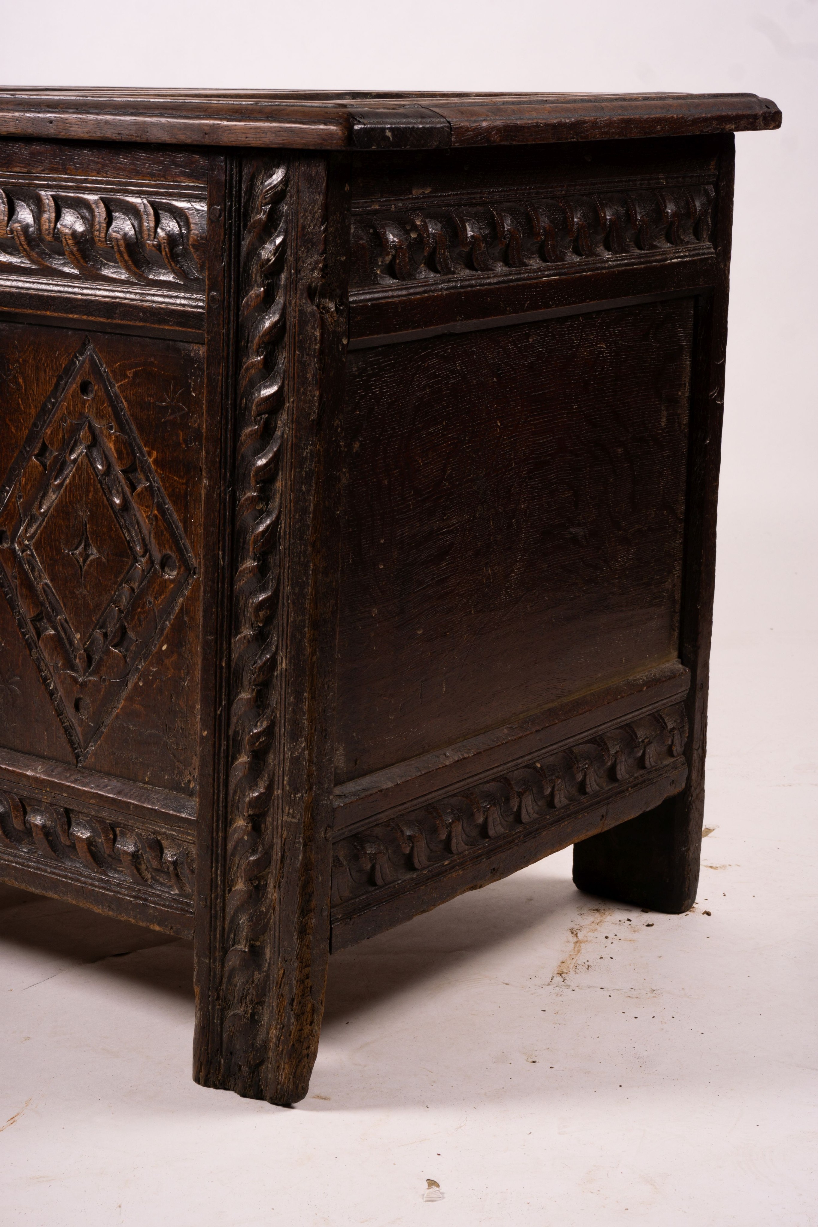 A 17th century carved panelled oak coffer, length 115cm, depth 56cm, height 67cm